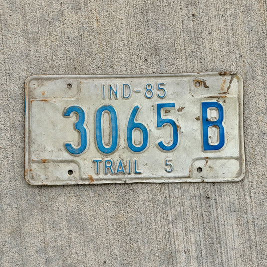 Photo of a 1985 Indiana Trailer License Plate Auto Tag Garage Decor Vintage 3065 B with original patina