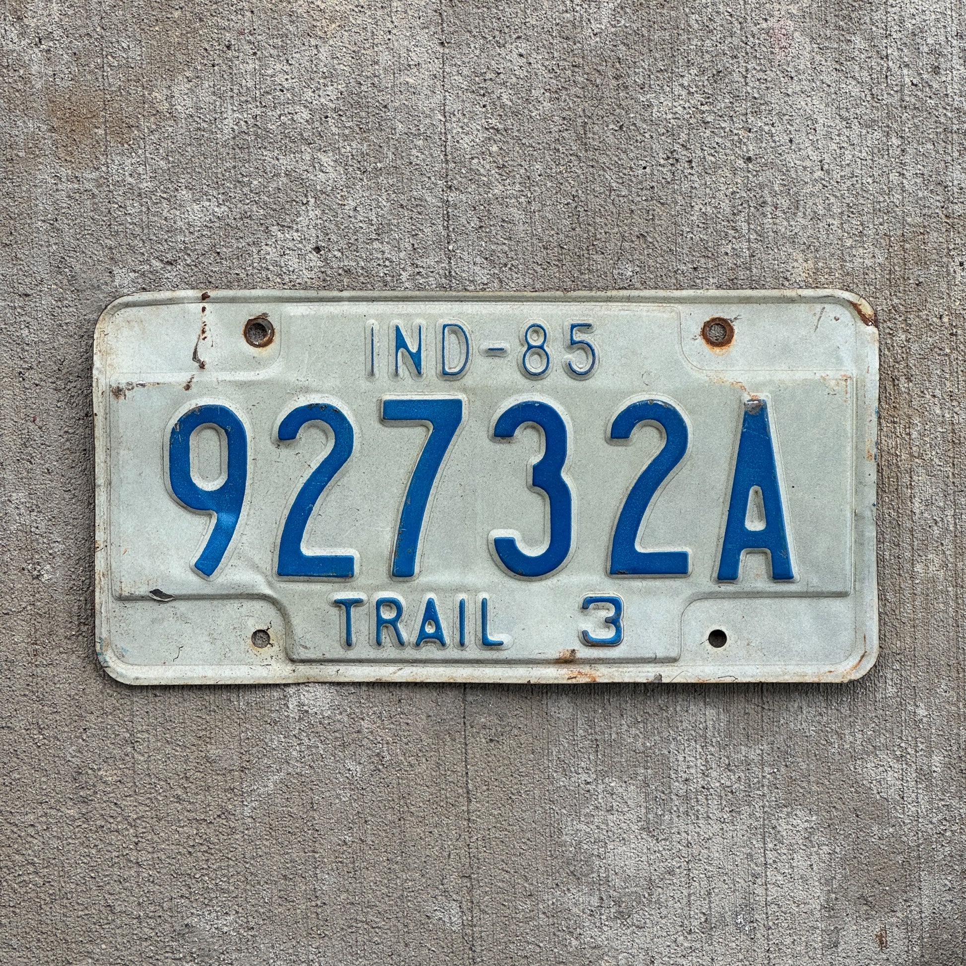Photo of a 1985 Indiana Trailer License Plate Auto Tag Garage Decor Vintage 92732 A with original patina