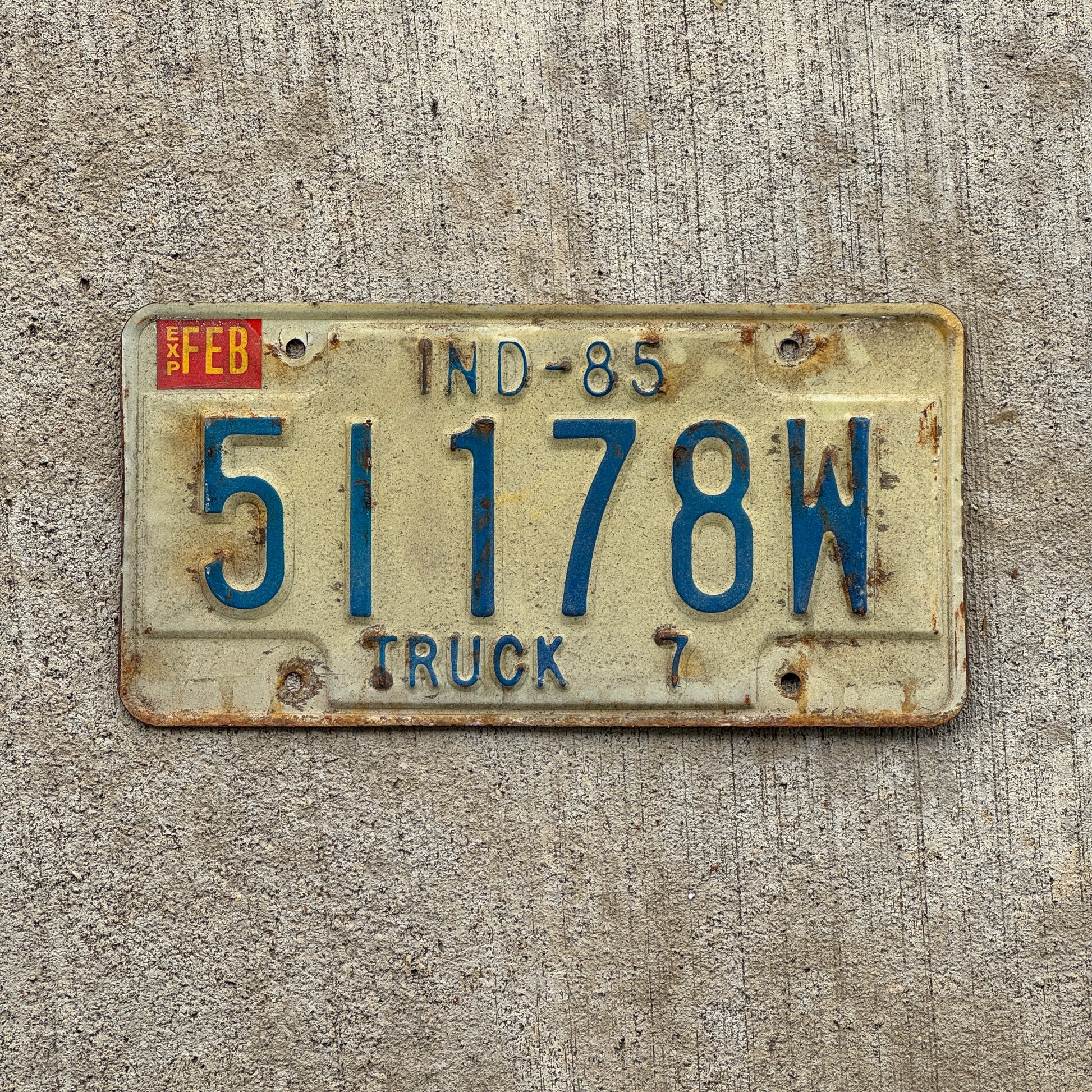 Photo of a 1985 Indiana Truck License Plate Auto Tag Garage Decor Vintage 51178 W with original patina