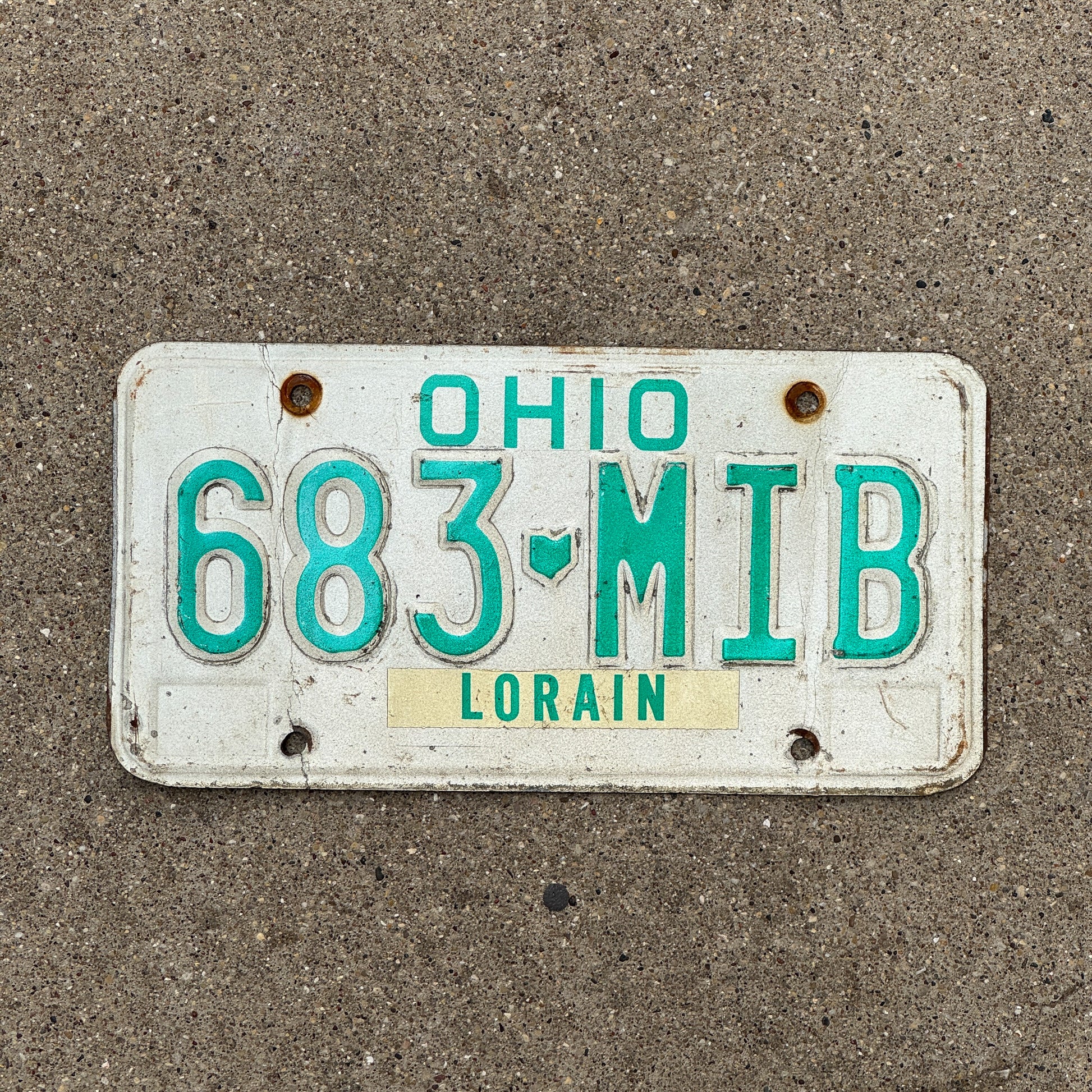 Photo of a 1985 Ohio License Plate Auto Tag 1 Vintage Garage 683 MIB with original patina