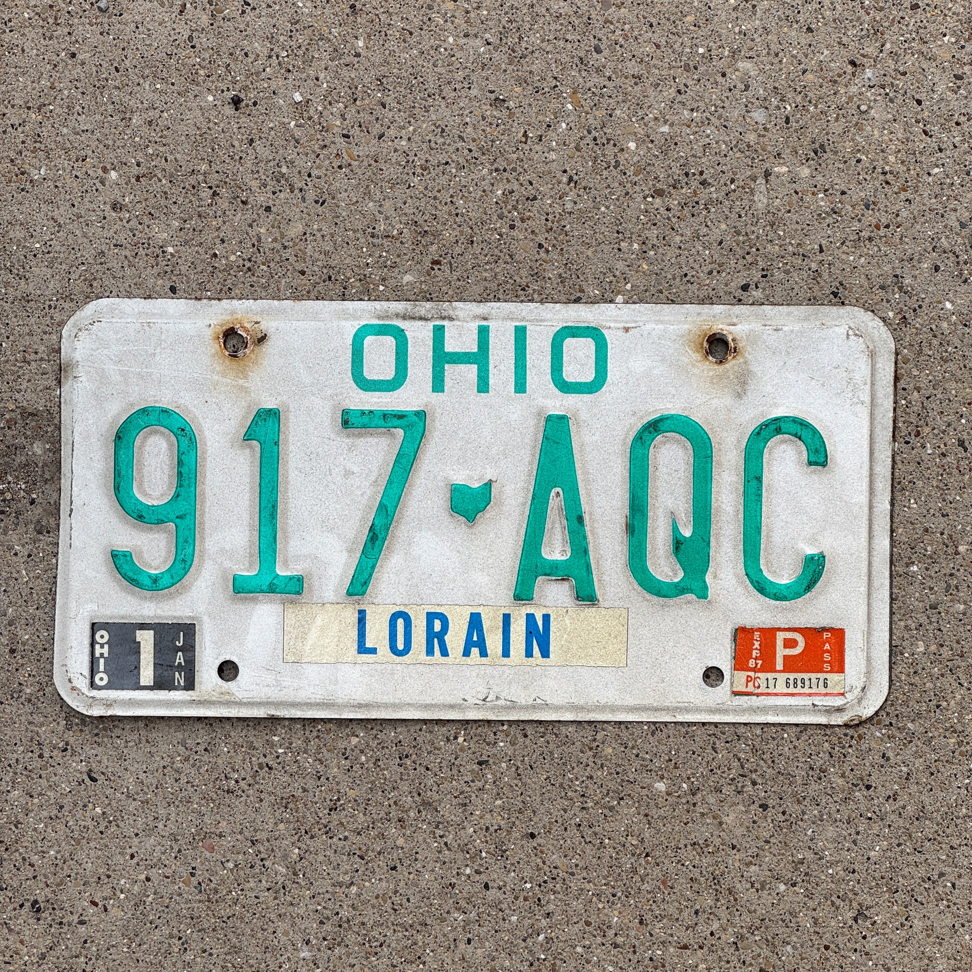 Photo of a 1985 Ohio License Plate Auto Tag 1 Vintage Garage 917 AQC with original patina