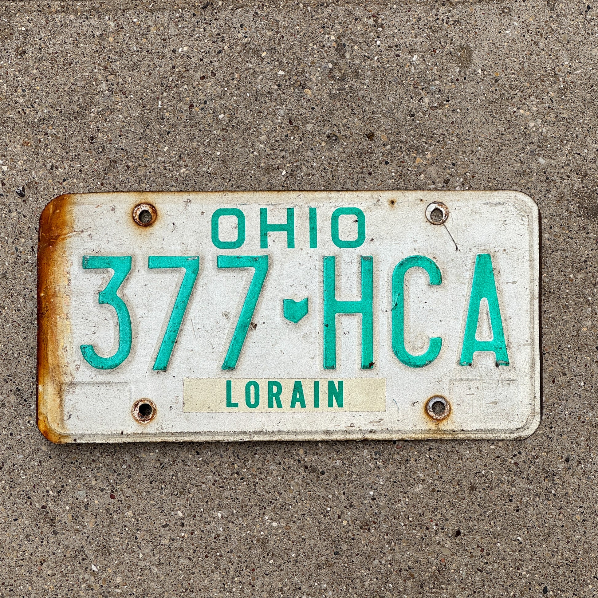 Photo of a 1985 Ohio License Plate Auto Tag 2 Vintage Garage 377 HCA with original patina