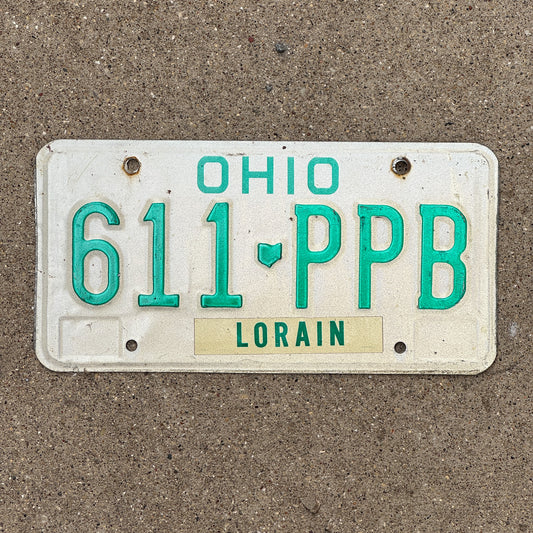 Photo of a 1985 Ohio License Plate Auto Tag 2 Vintage Garage 611 PPB with original patina