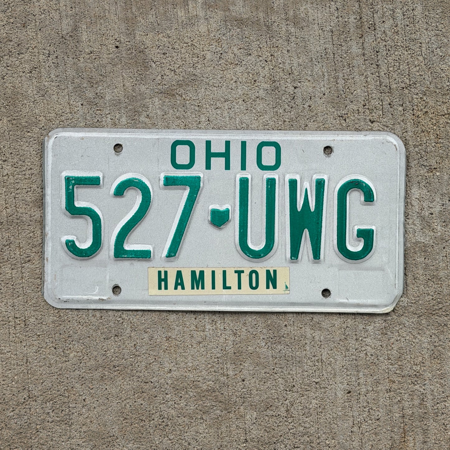 Photo of a 1985 Ohio License Plate Auto Tag Garage Decor Vintage 527 UWG with original patina