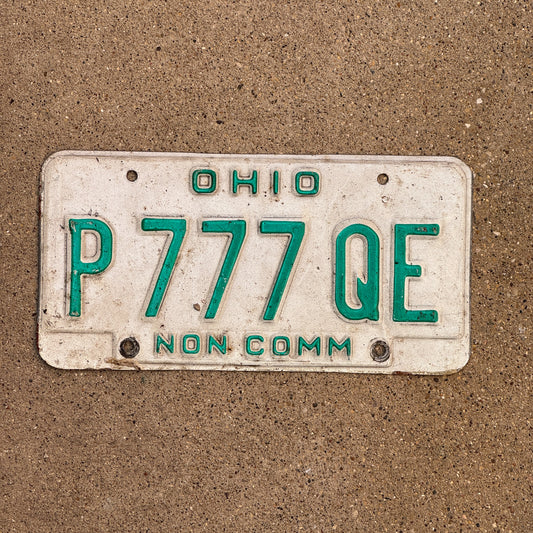Photo of a 1985 Ohio Truck License Plate Auto Tag Garage Decor Vintage Non Commercial Lucky 7 Repeat Repeating P 777 QE with original patina