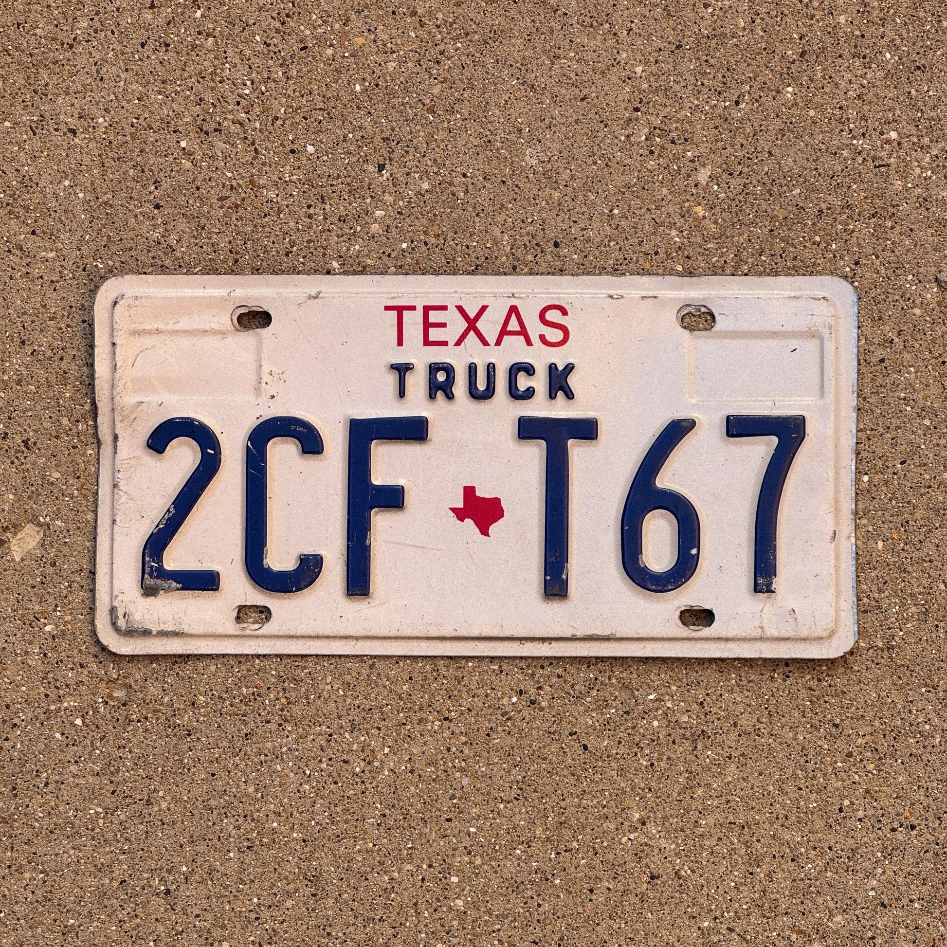 Photo of a 1985 Texas Truck License Plate Auto Tag Garage Decor Vintage 2CF T67