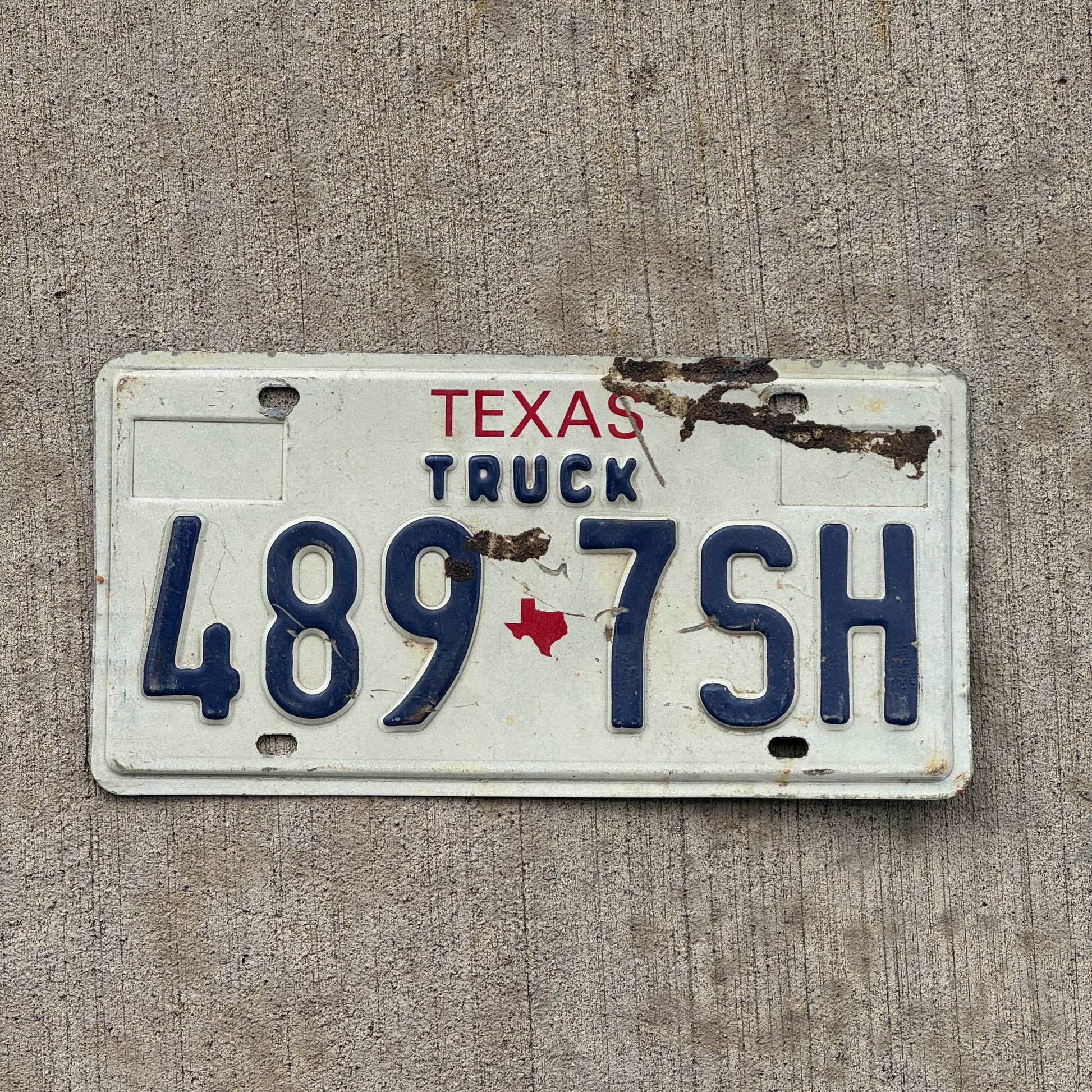Photo of a 1985 Texas Truck License Plate Auto Tag Garage Decor Vintage 489 7 SH with original patina