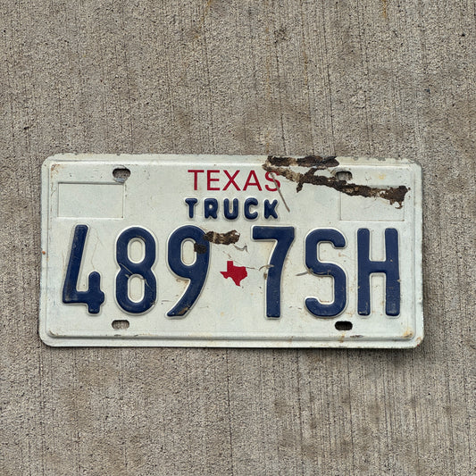 Photo of a 1985 Texas Truck License Plate Auto Tag Garage Decor Vintage 489 7 SH with original patina