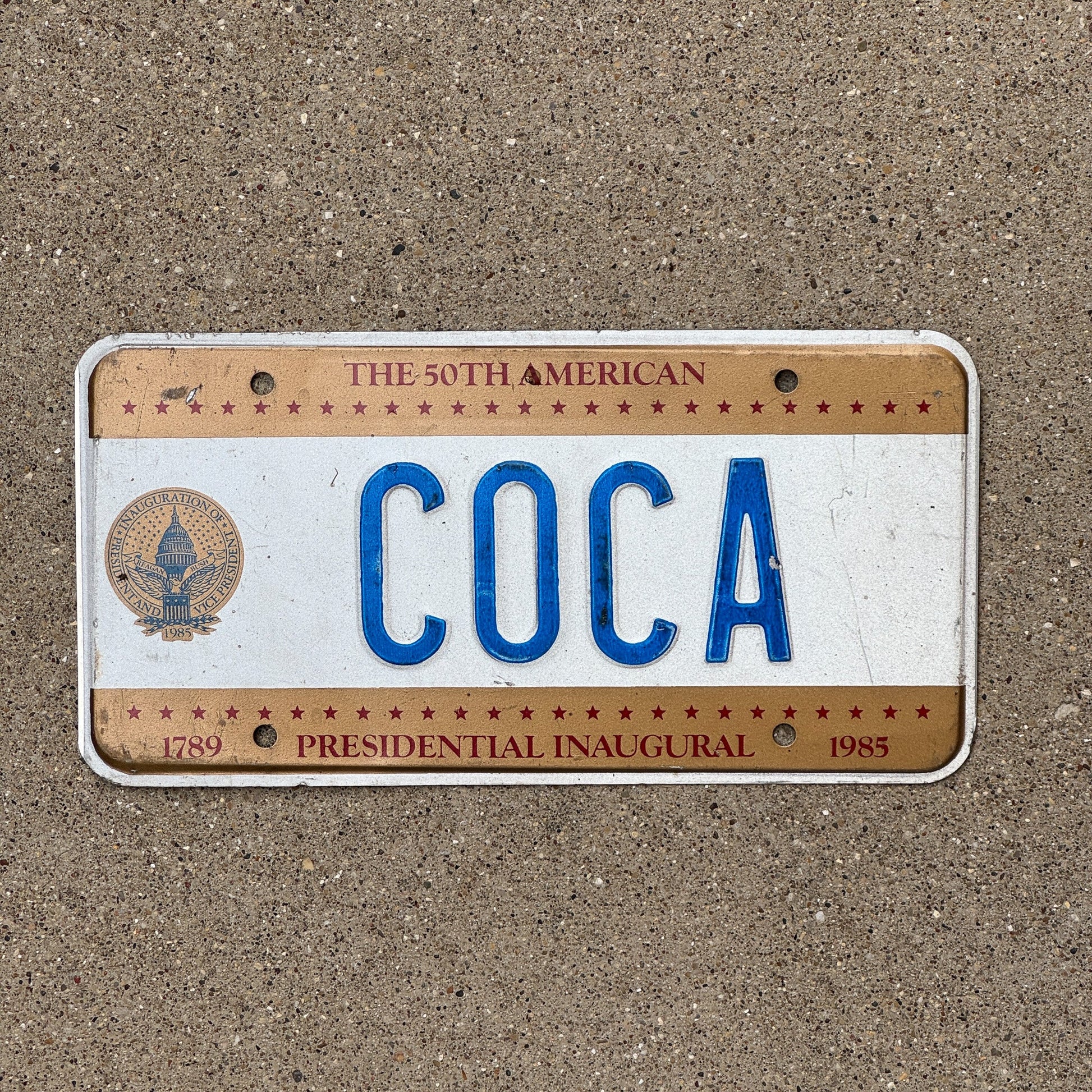 Photo of a 1985 Washington DC Inaugural License Plate Auto Tag Garage Decor Vintage President Cola Plant COCA