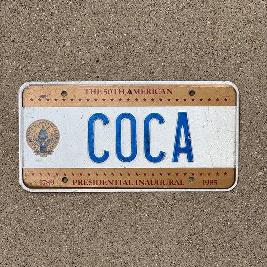 Photo of a 1985 Washington DC Inaugural License Plate Auto Tag Garage Decor Vintage President Cola Plant COCA