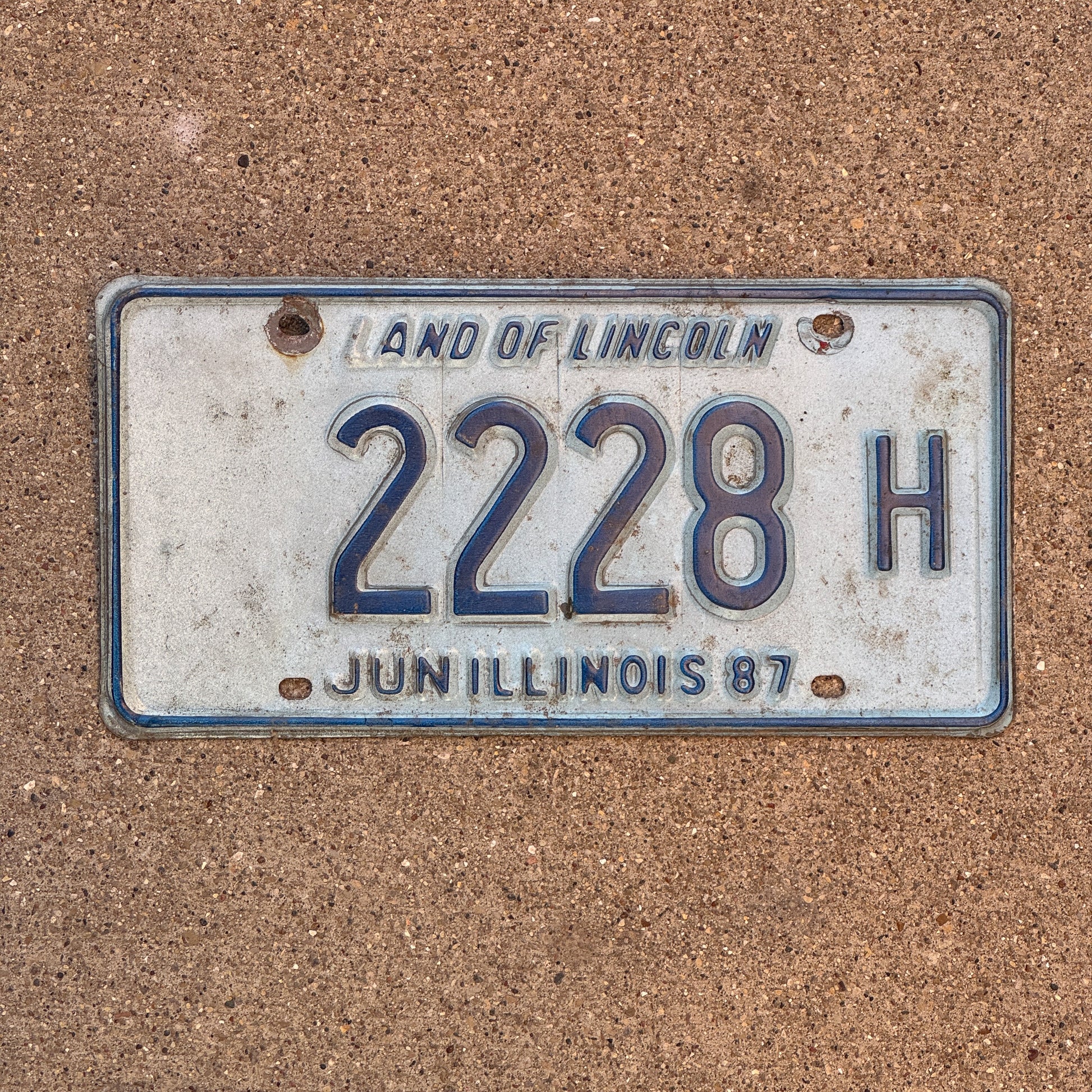 Photo of a 1986 1987 Illinois Truck License Plate Auto Tag 1 Vintage Garage Repeat Repeating 2228 H with original patina