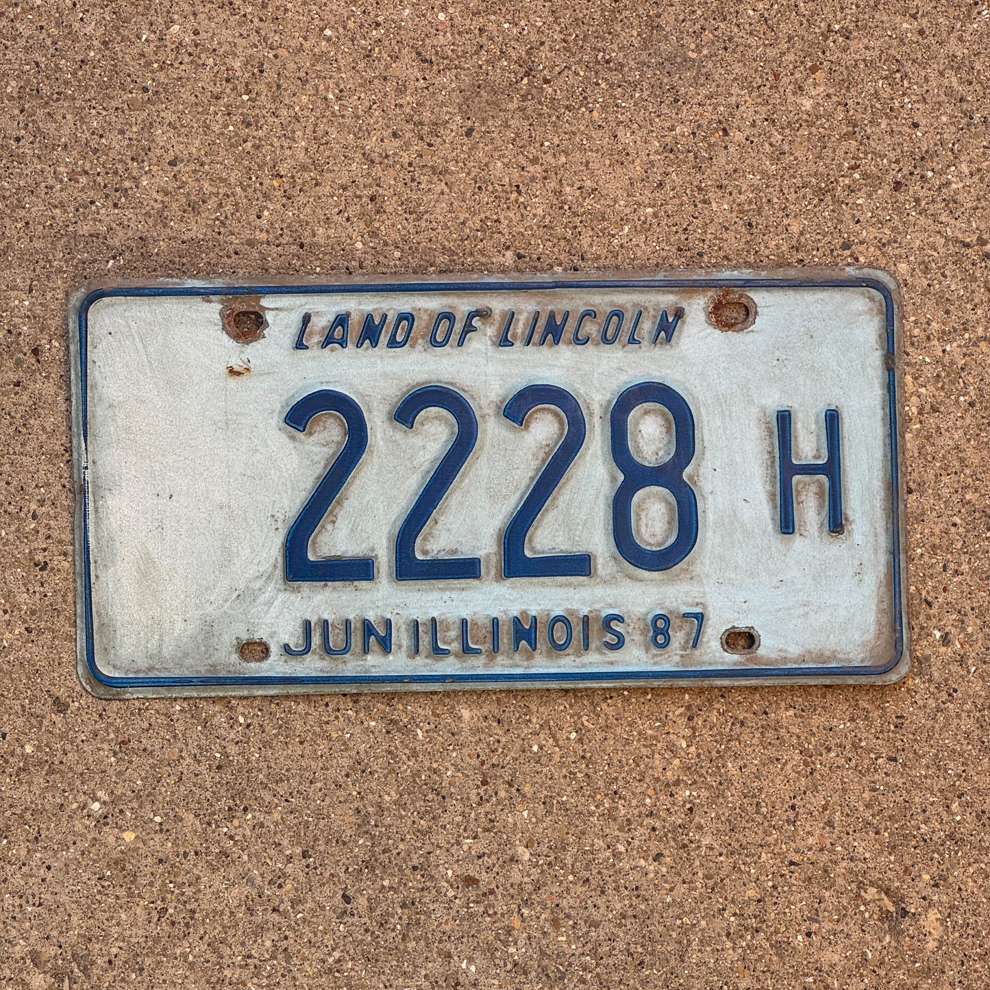 Photo of a 1986 1987 Illinois Truck License Plate Auto Tag 2 Vintage Garage Repeat Repeating 2228 H with original patina