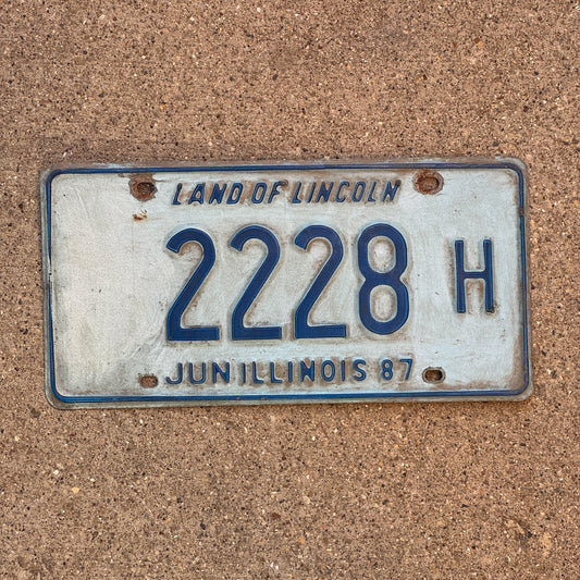 Photo of a 1986 1987 Illinois Truck License Plate Auto Tag 2 Vintage Garage Repeat Repeating 2228 H with original patina