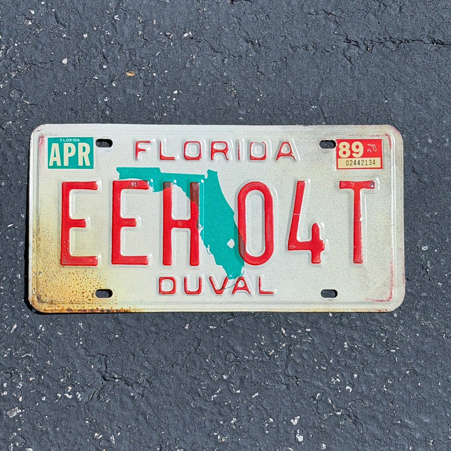 Photo of a 1986 1989 Florida License Plate Auto Tag Garage Decor Vintage EEH 04T with original patina