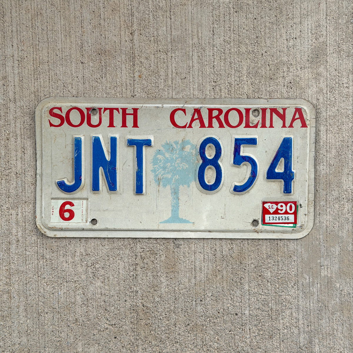 Photo of a 1986 1990 South Carolina License Plate Auto Tag Garage Decor Vintage JNT 854 with original patina