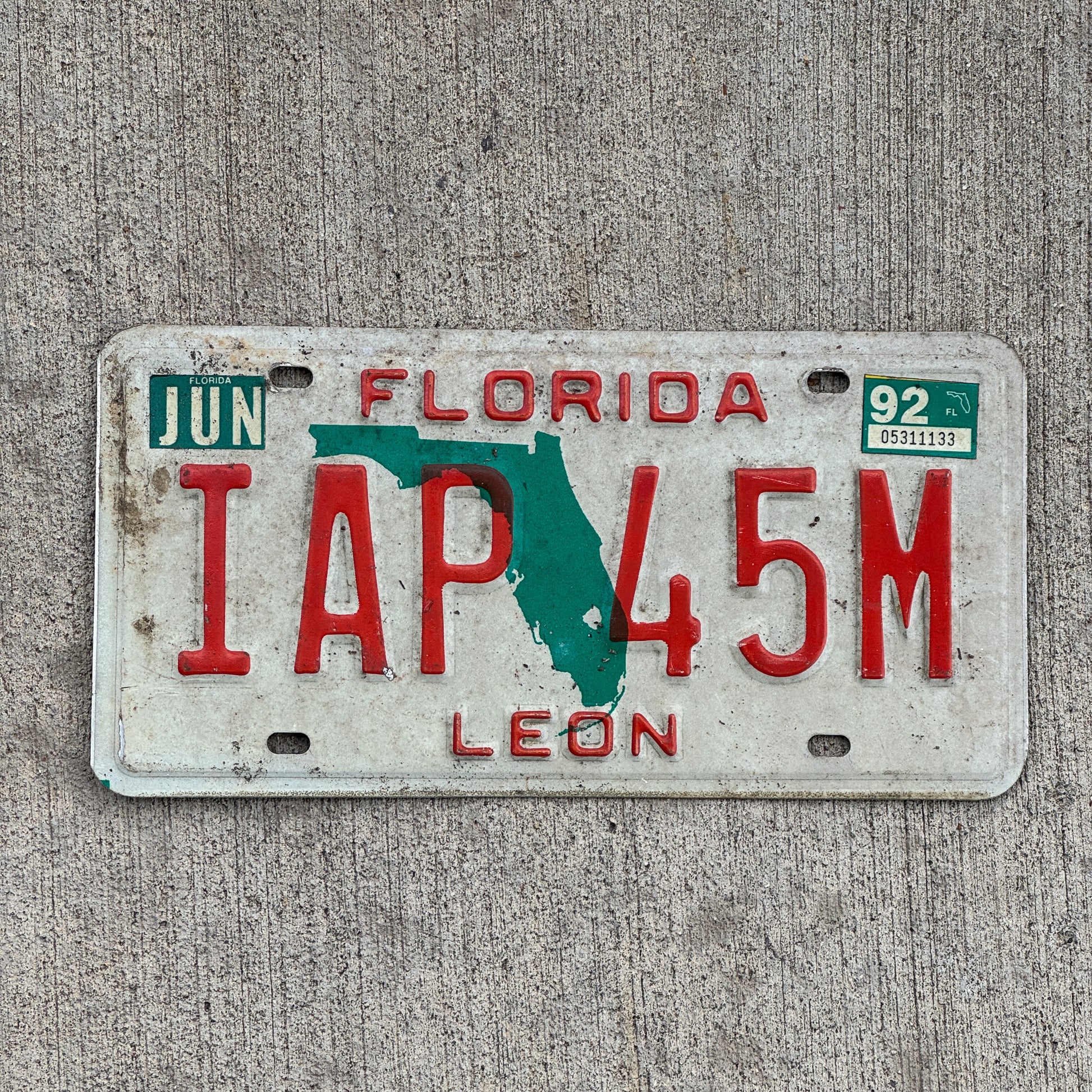Photo of a 1986 1992 Florida License Plate Auto Tag Garage Decor Vintage IAP 45M with original patina