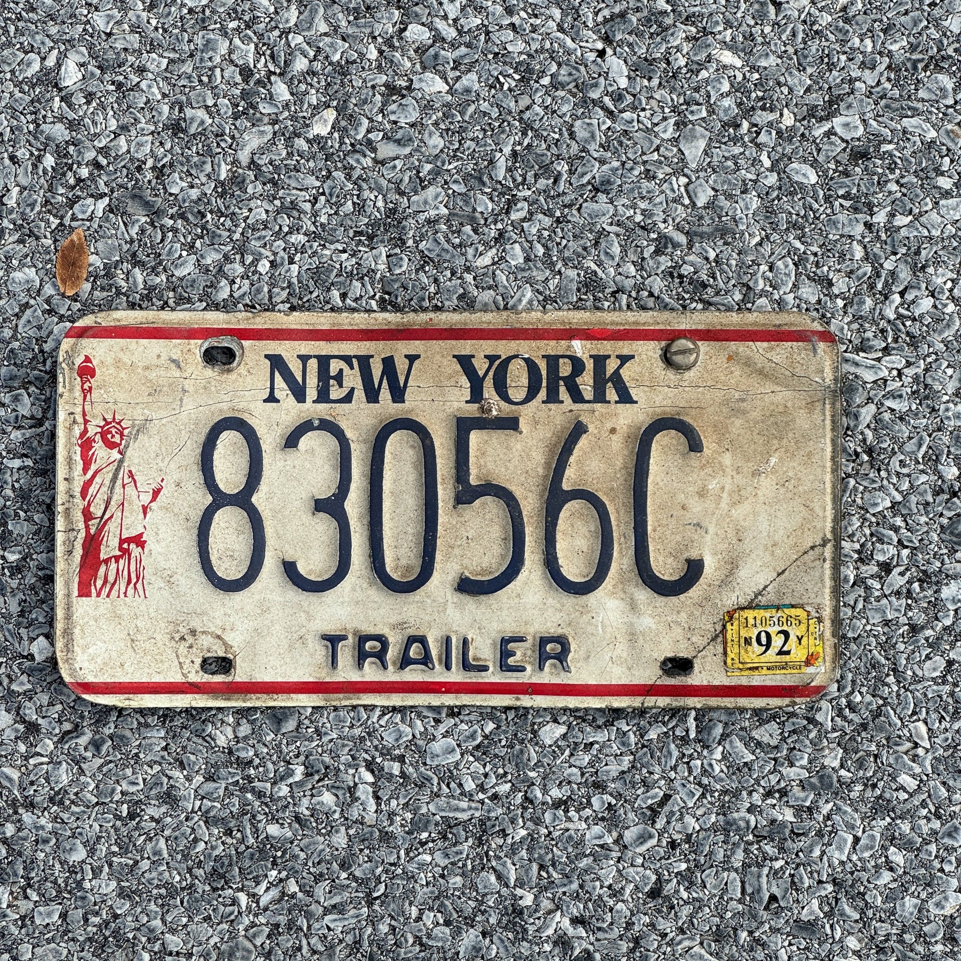 Photo of a 1986 1992 New York Trailer License Plate Auto Tag Garage Decor Vintage Liberty Base 83056C