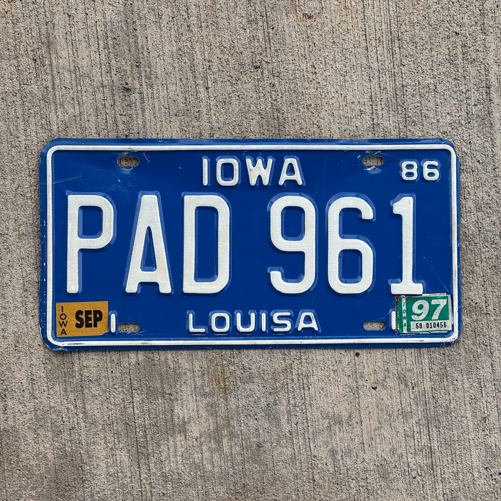 Photo of a 1986 1997 Iowa License Plate Auto Tag Garage Decor Vintage PAD 961 with original patina