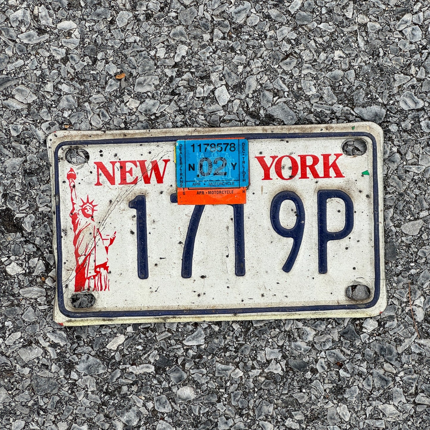 Photo of a 1986 2002 New York Motorcycle License Plate Auto Tag Garage Decor Vintage Liberty Base 1719P