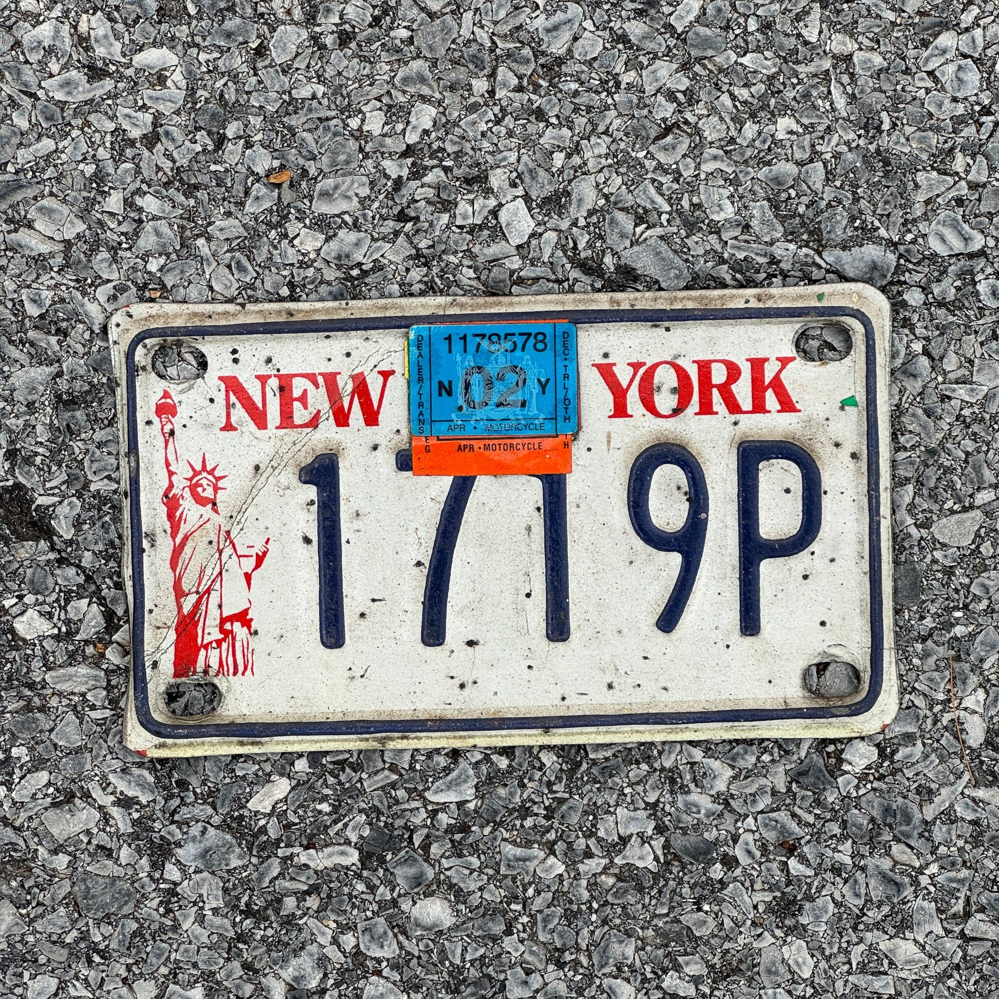 Photo of a 1986 2002 New York Motorcycle License Plate Auto Tag Garage Decor Vintage Liberty Base 1719P
