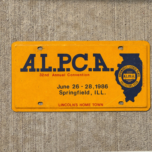 Photo of a 1986 Illinois Booster License Plate Auto Tag Garage Decor Vintage Springfield ALPCA Convention