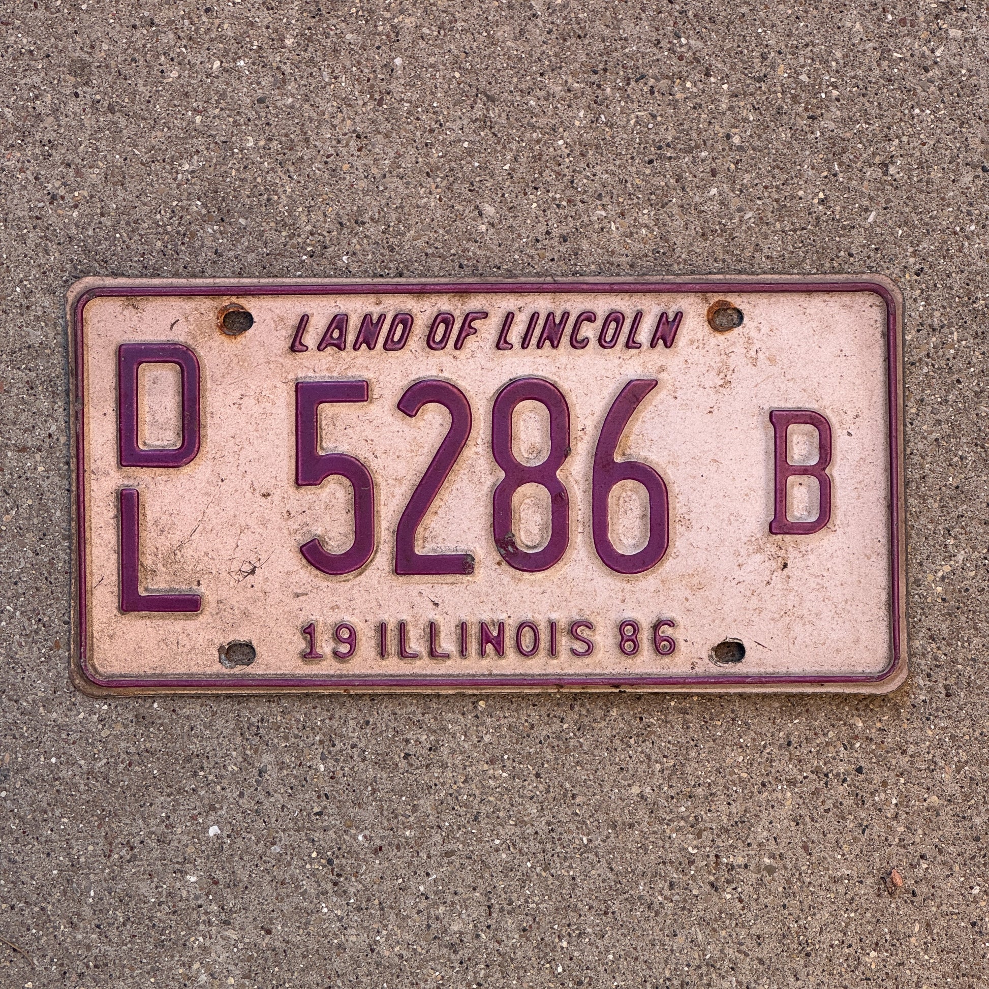 Photo of a 1986 Illinois Dealer License Plate Auto Tag 1 Vintage Garage 5286 B with original patina