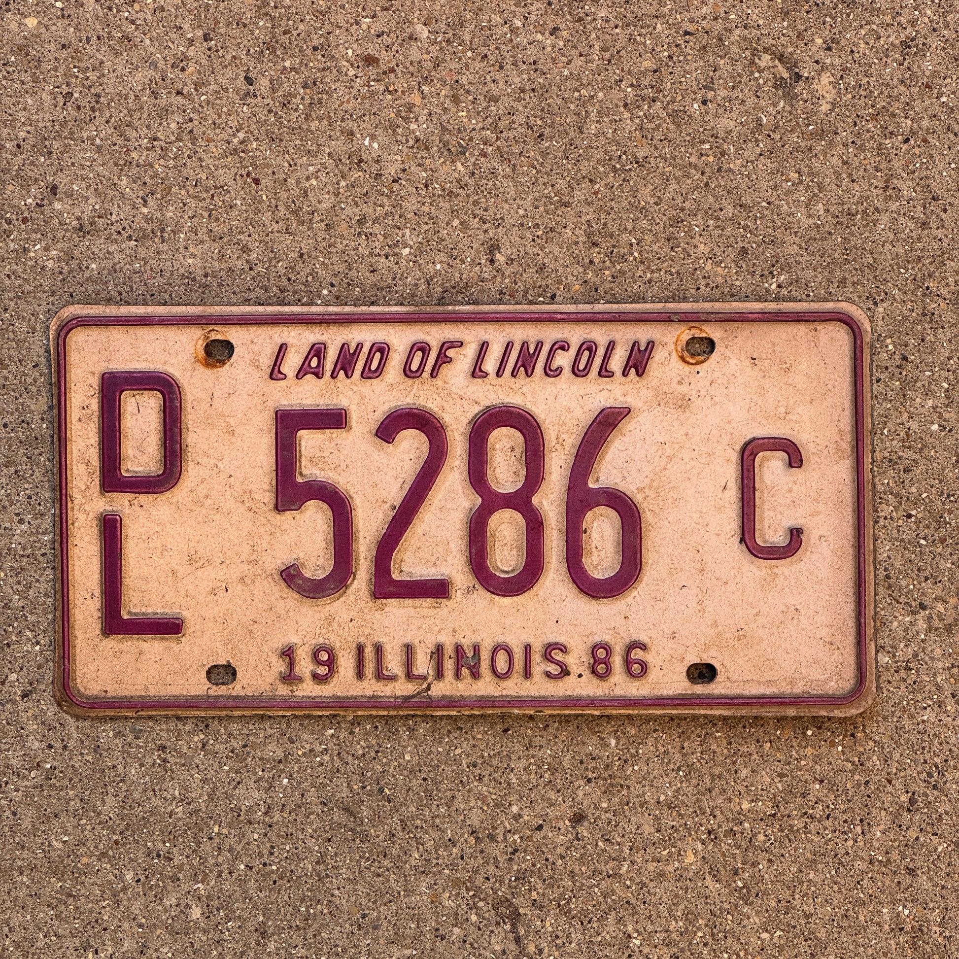 Photo of a 1986 Illinois Dealer License Plate Auto Tag 1 Vintage Garage 5286 C with original patina