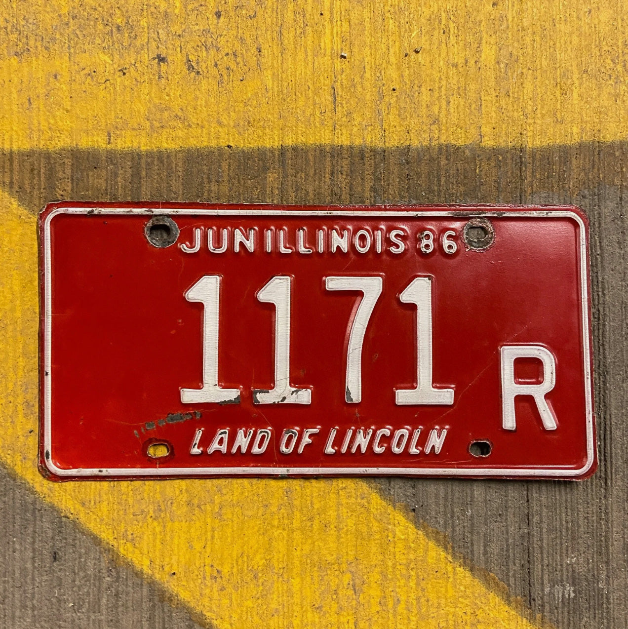 Photo of a 1986 Illinois Truck License Plate Auto Tag Garage Decor Vintage 1171 R with original patina