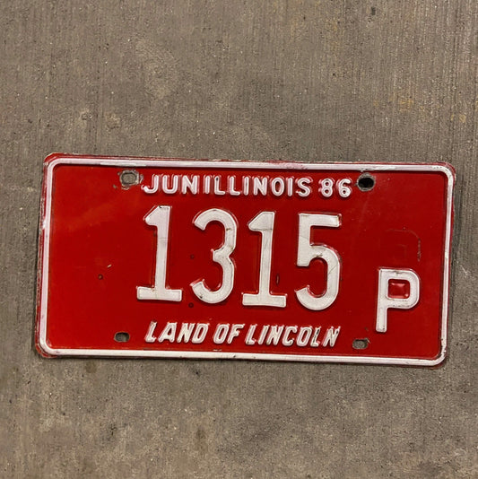 Photo of a 1986 Illinois Truck License Plate Auto Tag Garage Decor Vintage 1315 P with original patina