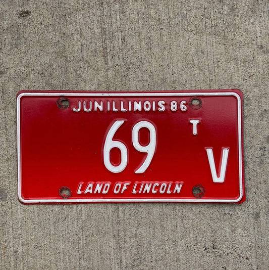 Photo of a 1986 Illinois Truck Tractor License Plate Auto Tag Garage Decor Vintage Low Number Two Digit 69 TV with original patina