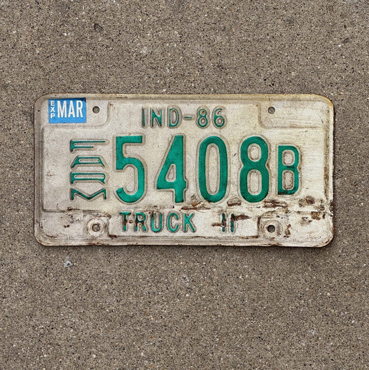 Photo of a 1986 Indiana Farm Truck License Plate Auto Tag Garage Decor 5408 B
