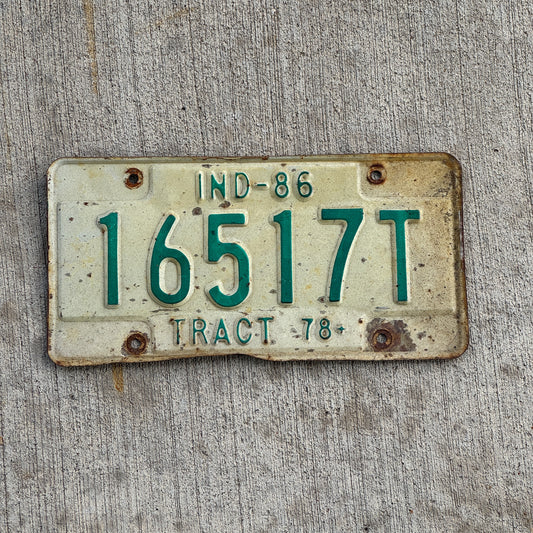Photo of a 1986 Indiana Tractor License Plate Auto Tag Garage Decor Vintage 16517 T with original patina