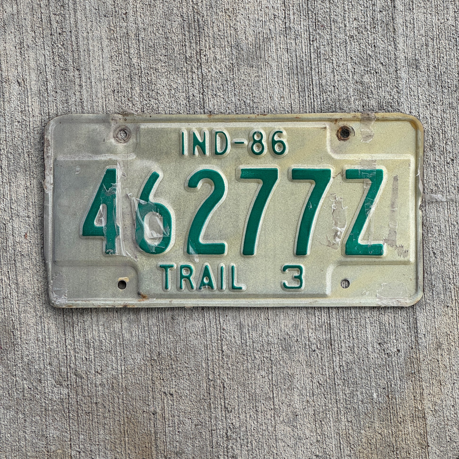 Photo of a 1986 Indiana Trailer License Plate Auto Tag Garage Decor Vintage 46277 Z with original patina