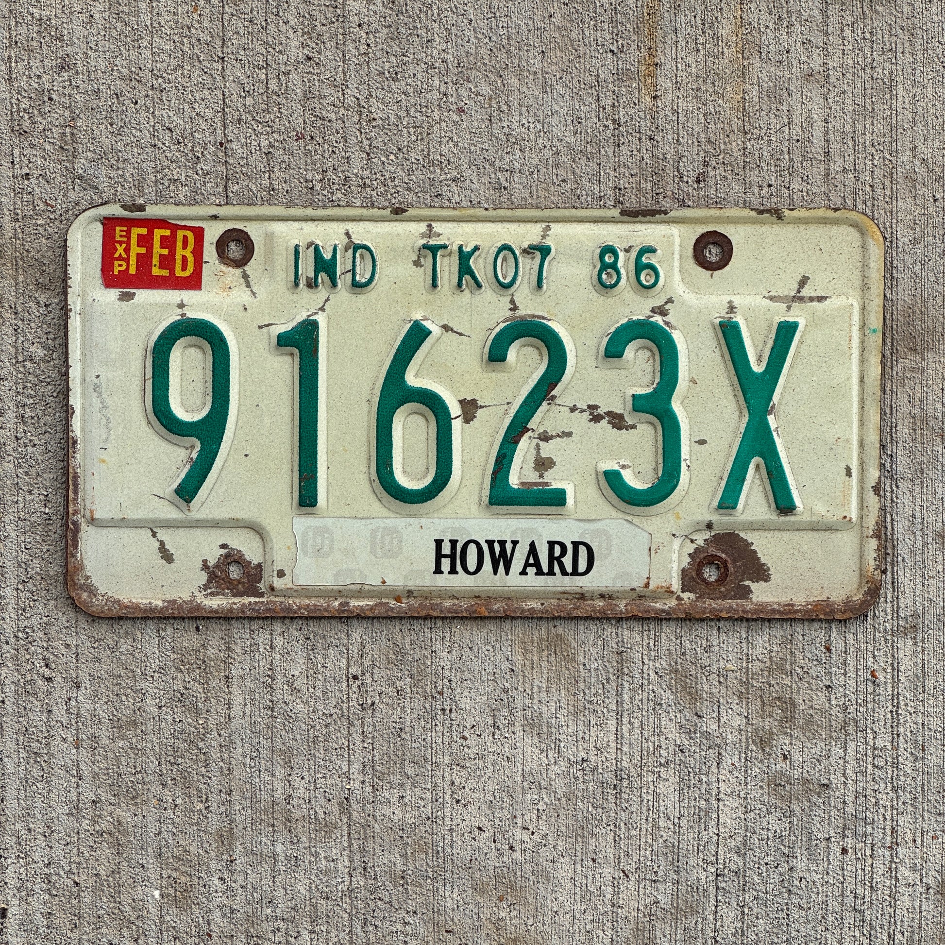 Photo of a 1986 Indiana Truck License Plate Auto Tag Garage Decor Vintage 91623 X with original patina