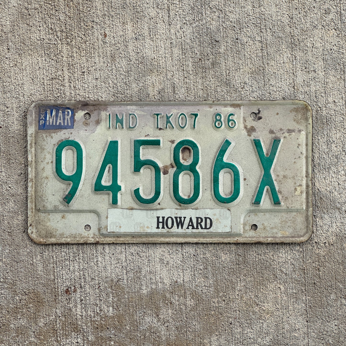 Photo of a 1986 Indiana Truck License Plate Auto Tag Garage Decor Vintage 94586 X with original patina