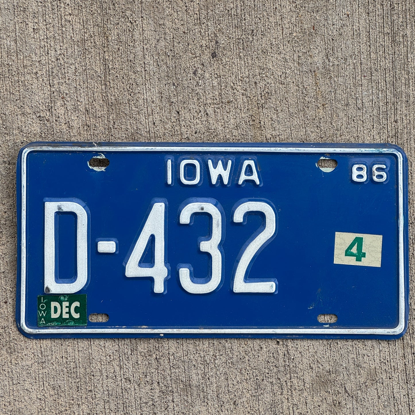 Photo of a 1986 Iowa Dealer License Plate Auto Tag Garage Decor Vintage D 432 with original patina