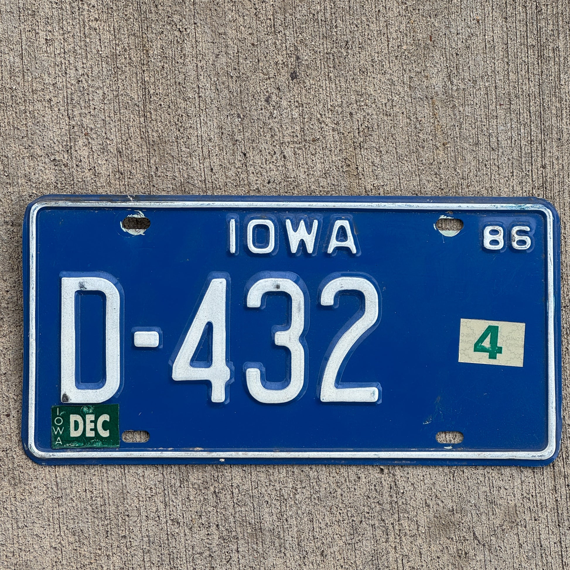 Photo of a 1986 Iowa Dealer License Plate Auto Tag Garage Decor Vintage D 432 with original patina