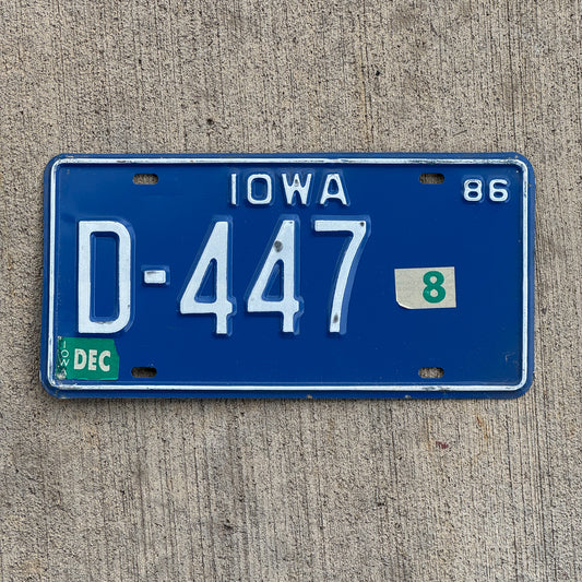 Photo of a 1986 Iowa Dealer License Plate Auto Tag Garage Decor Vintage D 447 with original patina