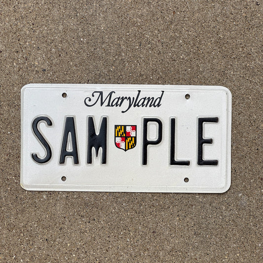 Photo of a 1986 Maryland SAMPLE License Plate Auto Tag Garage Decor Vintage Lobster SAMPLE