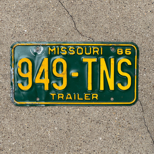 Photo of a 1986 Missouri Trailer License Plate Auto Tag Garage Decor Vintage 949 TNS
