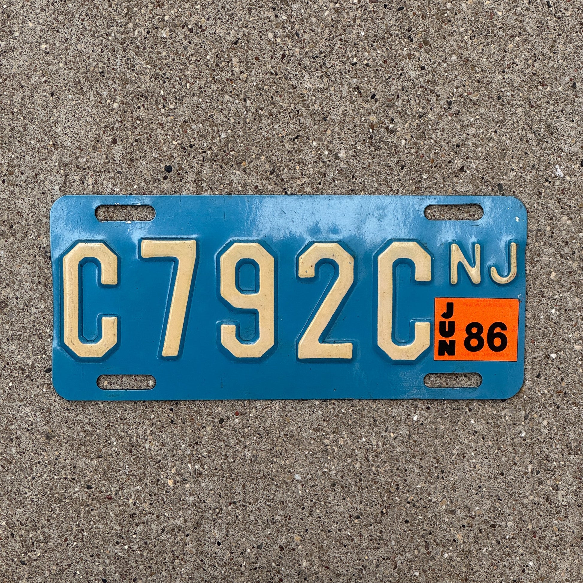 Photo of a 1986 New Jersey Motorcycle License Plate Auto Tag Garage Decor Vintage Natural 1986 Sticker C 792C with original patina