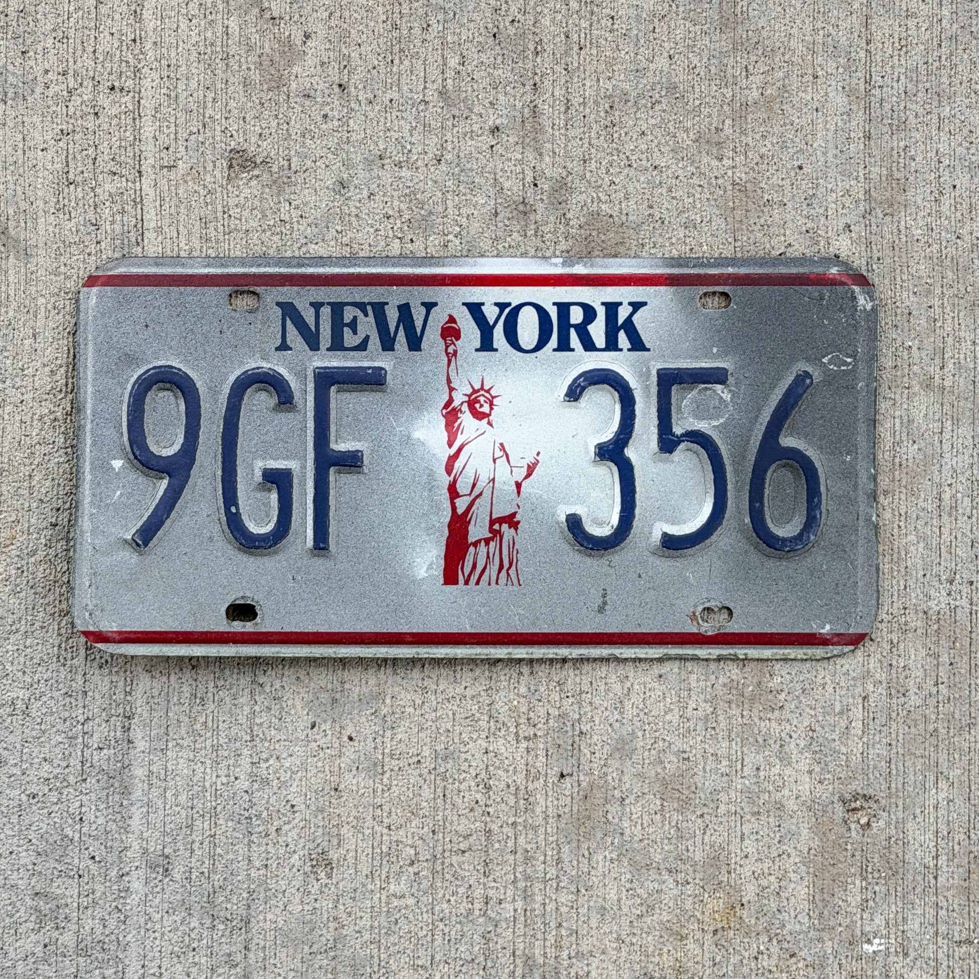 Photo of a 1986 New York License Plate Auto Tag Garage Decor Vintage Liberty Base 9 GF 356 with original patina