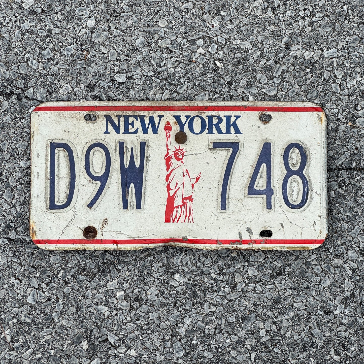 Photo of a 1986 New York License Plate Auto Tag Garage Decor Vintage Liberty Base D9W 748