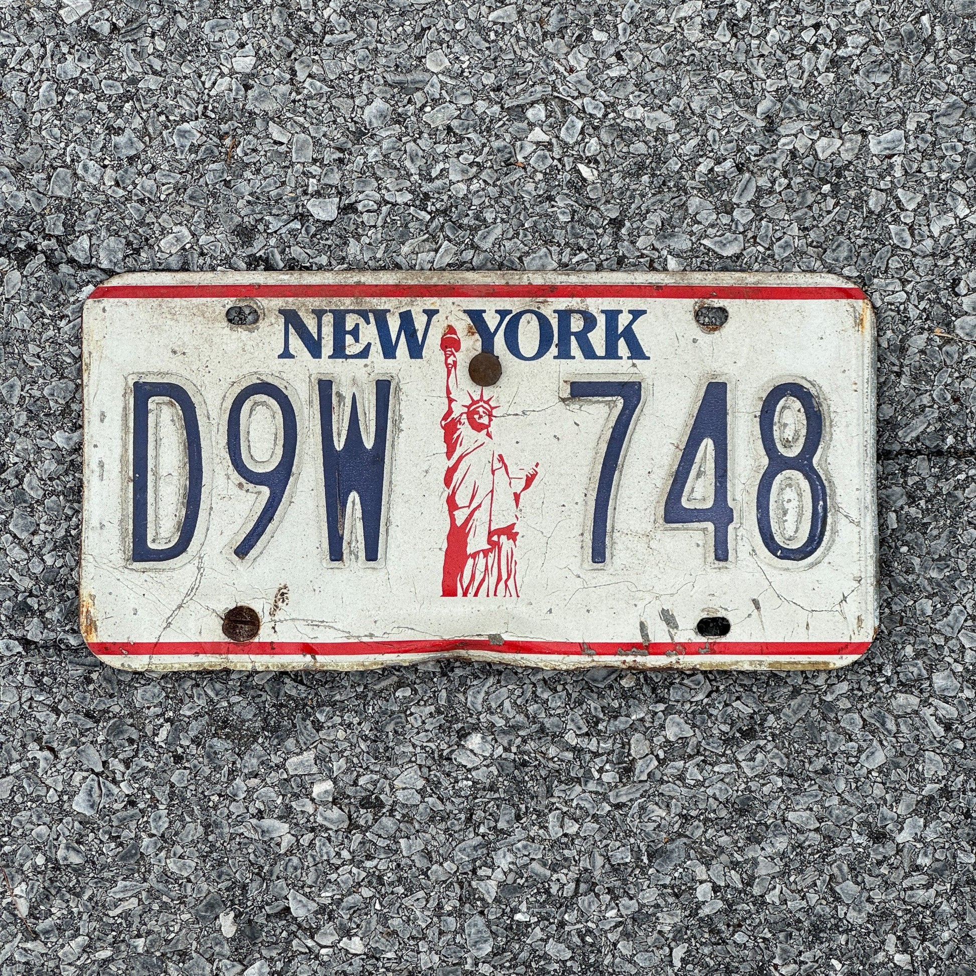 Photo of a 1986 New York License Plate Auto Tag Garage Decor Vintage Liberty Base D9W 748