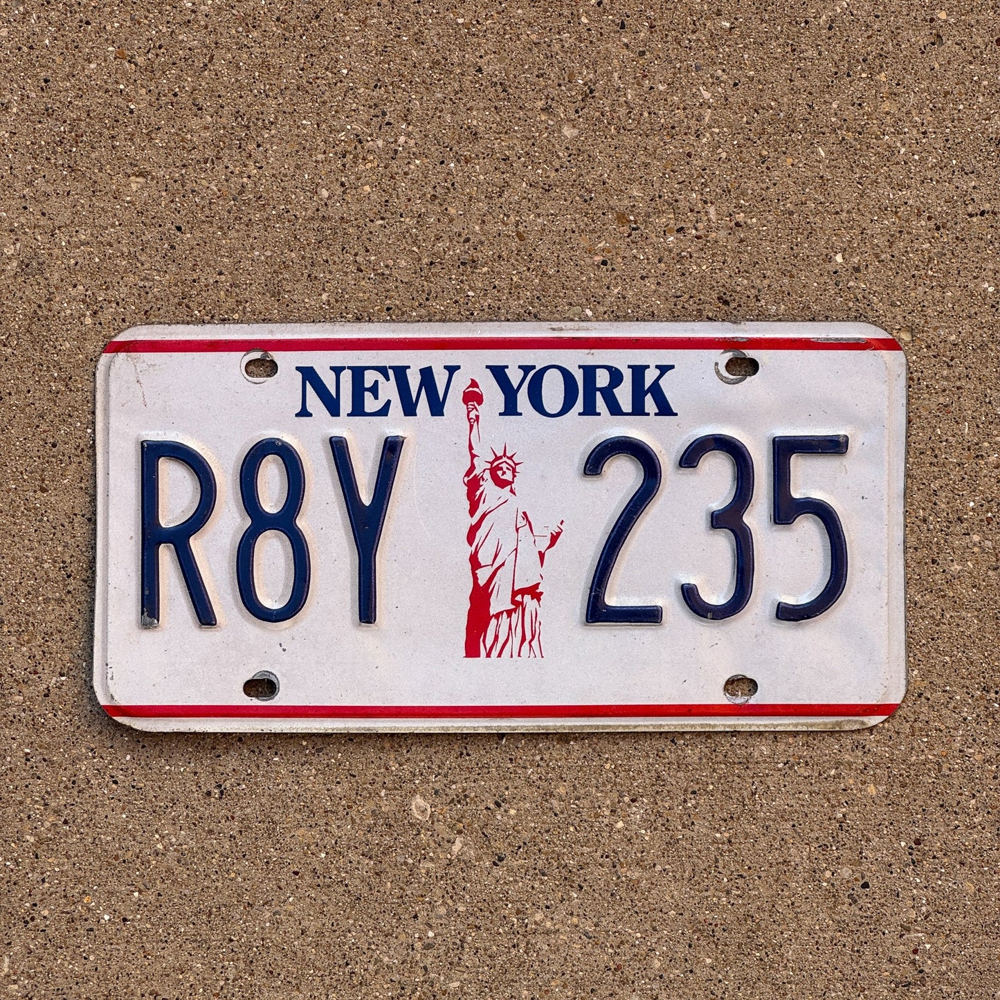 Photo of a 1986 New York License Plate Auto Tag Garage Decor Vintage Liberty Base R8Y 235