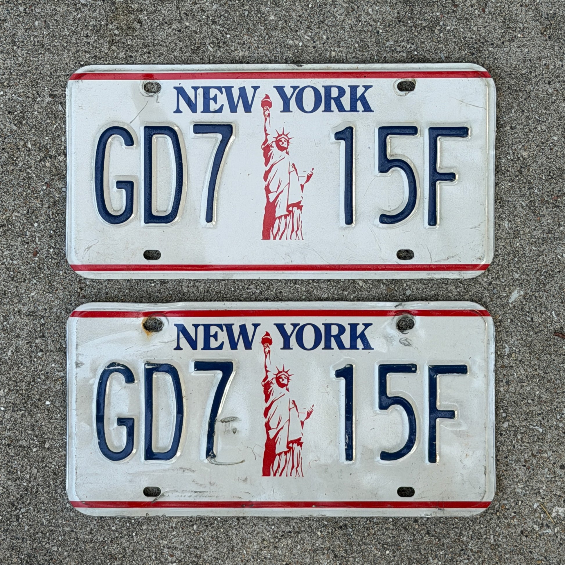 Photo of a 1986 New York License Plate Pair Auto Tag Garage Decor Vintage Liberty Base GD 7 15F with original patina