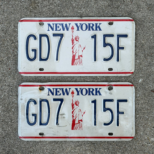 Photo of a 1986 New York License Plate Pair Auto Tag Garage Decor Vintage Liberty Base GD 7 15F with original patina