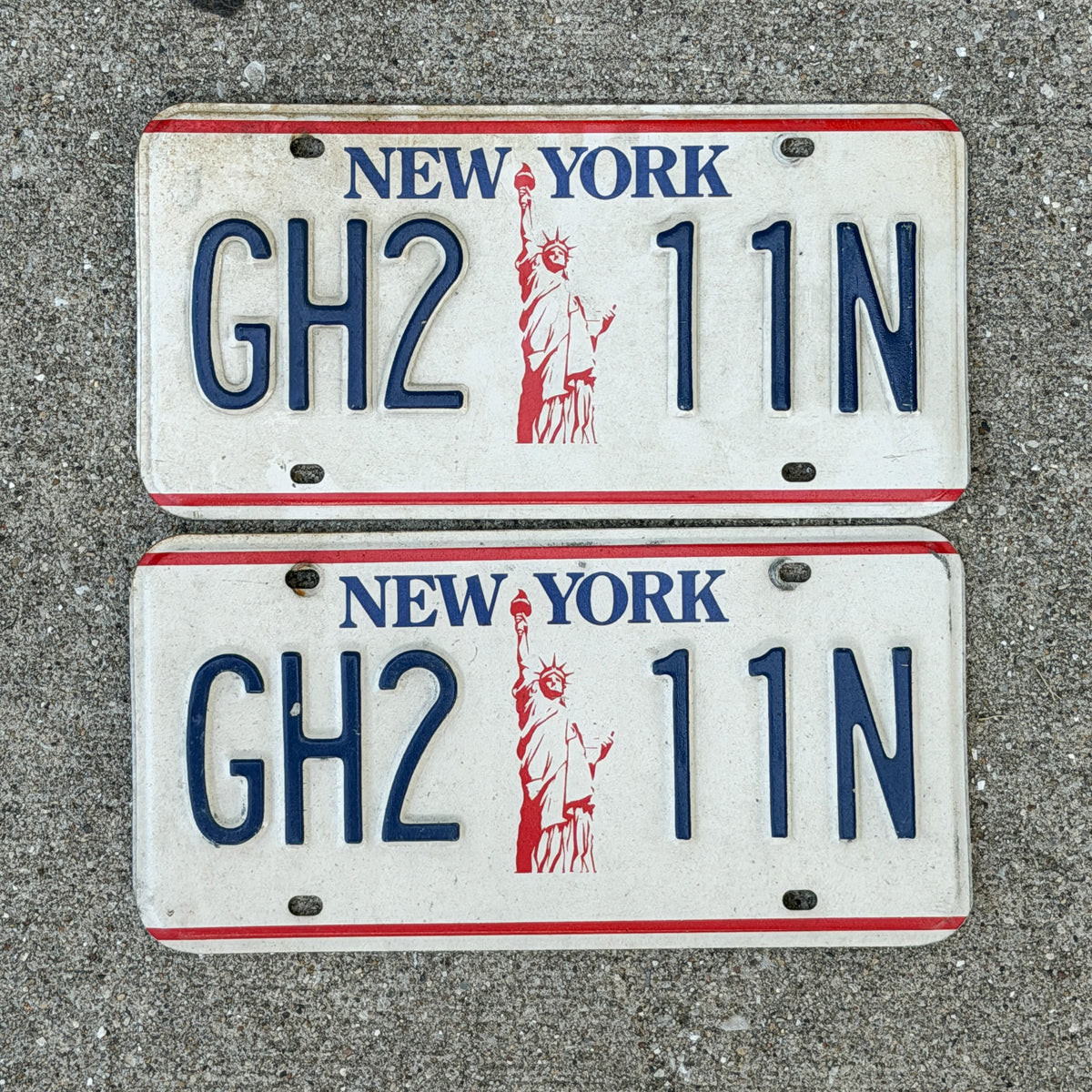 Photo of a 1986 New York License Plate Pair Auto Tag Garage Decor Vintage Liberty Base GH 2 11N with original patina