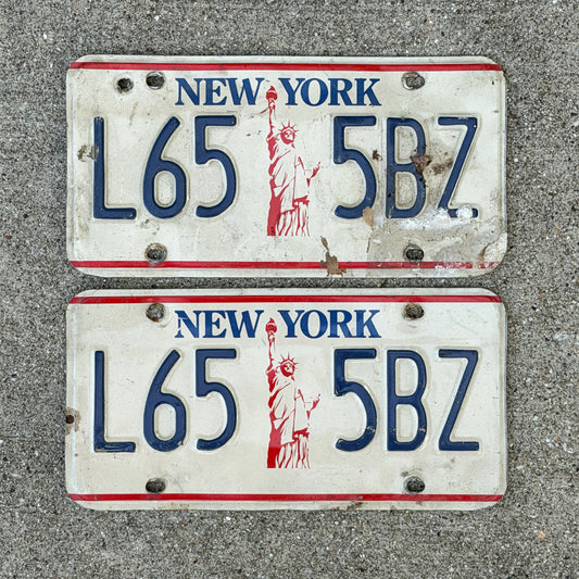 Photo of a 1986 New York License Plate Pair Auto Tag Garage Decor Vintage Liberty Base L65 5 BZ with original patina