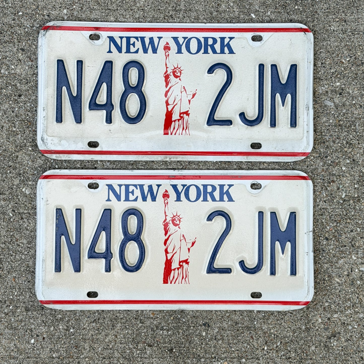 Photo of a 1986 New York License Plate Pair Auto Tag Garage Decor Vintage Liberty Base N48 2 JM with original patina